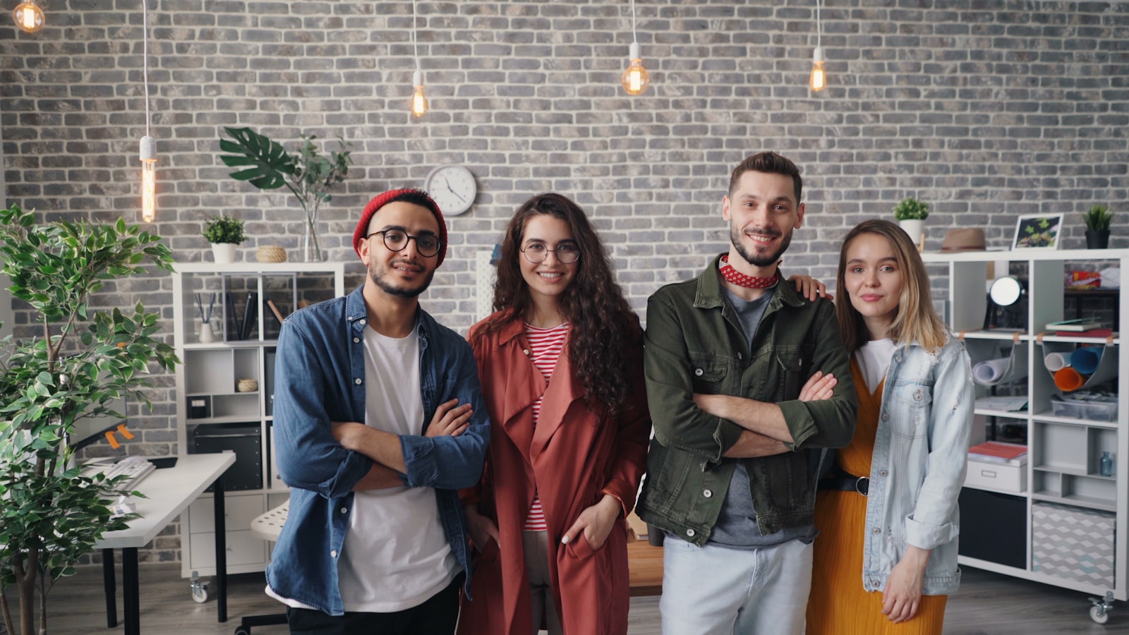 Independent business owners standing together in their shared workspace.