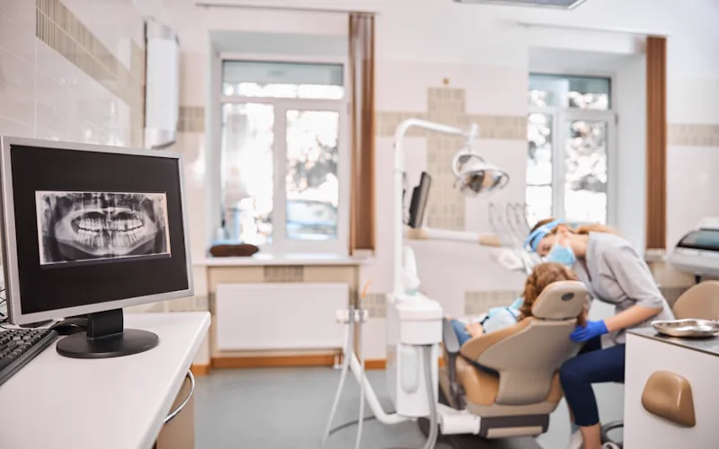 A modern dental office with chair and operatory equipment